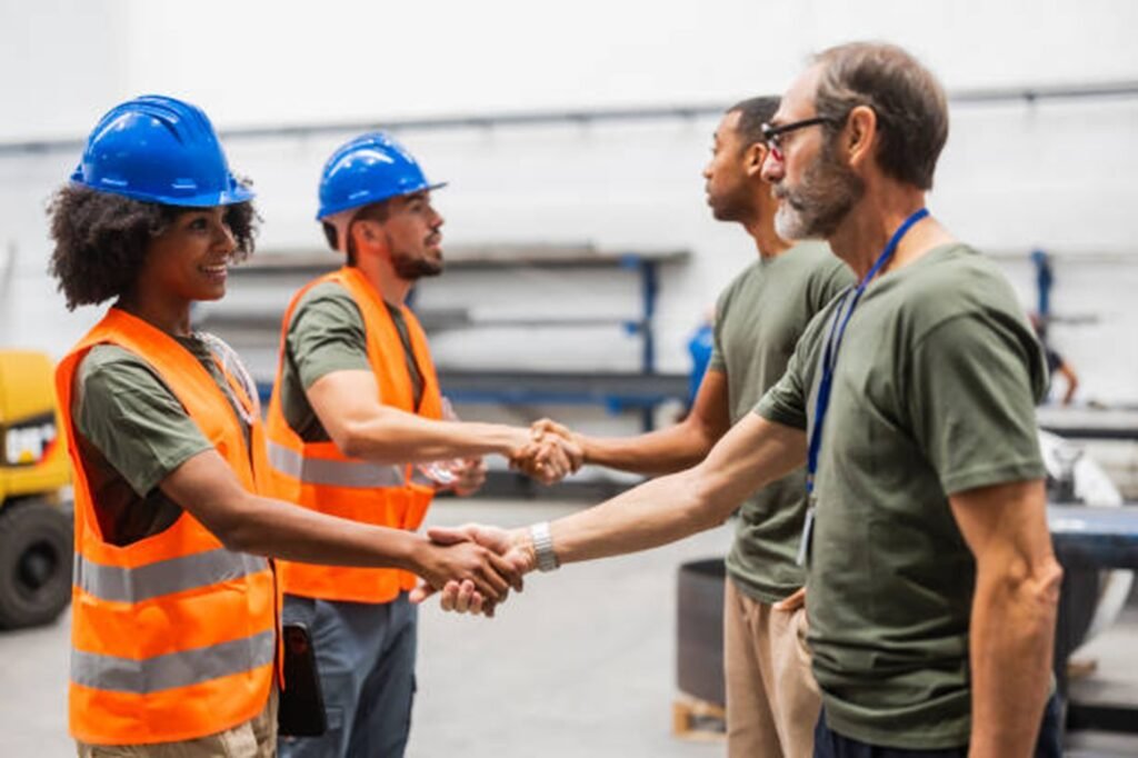Tree service professionals shaking hands with clients during a project discussion in Lyndhurst, OH