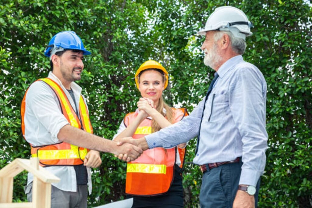 Professional tree service team discussing project details with homeowner after tree trimming job in Lyndhurst, OH